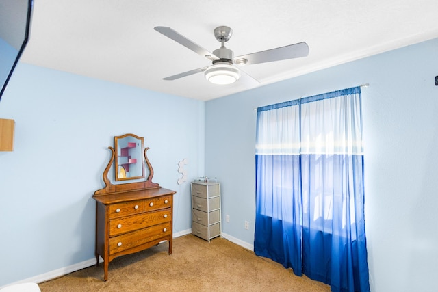 bedroom with light carpet and ceiling fan