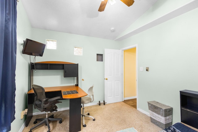 carpeted home office featuring ceiling fan and vaulted ceiling