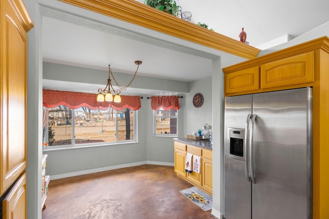 kitchen with a chandelier and stainless steel refrigerator with ice dispenser