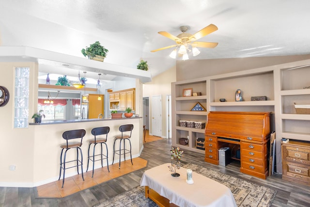 living room with dark hardwood / wood-style flooring, ceiling fan, and lofted ceiling