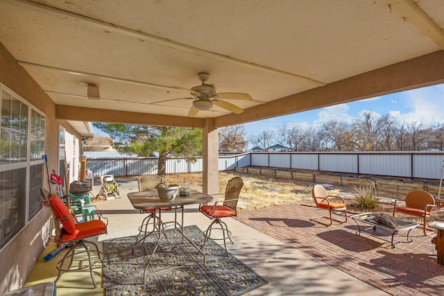 view of patio featuring ceiling fan