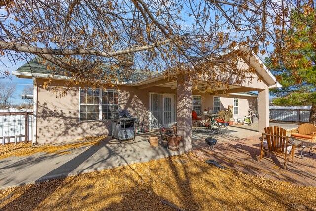 back of property with a patio