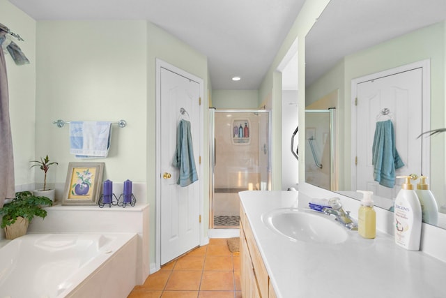 bathroom with tile patterned floors, separate shower and tub, and vanity