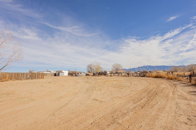 view of yard featuring a mountain view and a rural view