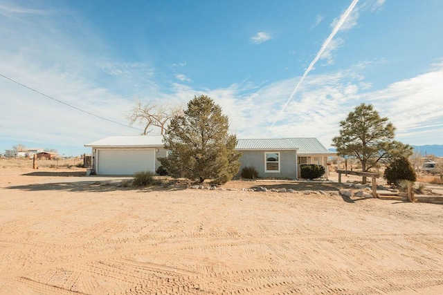 ranch-style home featuring a garage