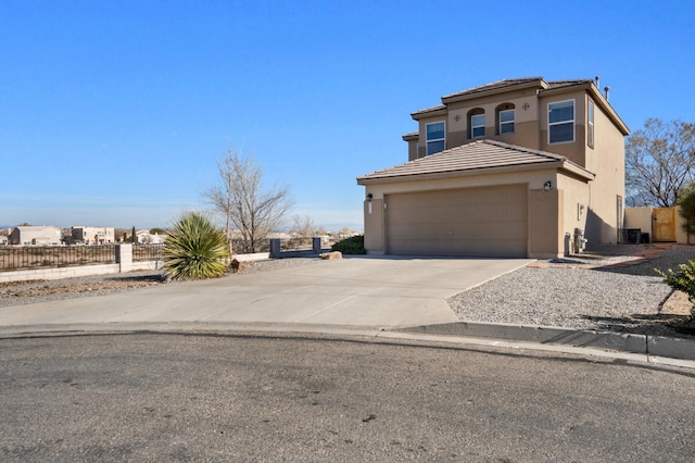 view of front of house featuring cooling unit and a garage