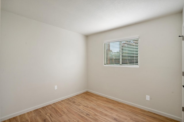 unfurnished room featuring light hardwood / wood-style floors