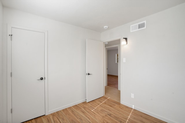 unfurnished bedroom featuring light hardwood / wood-style flooring