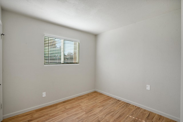 spare room with light wood-type flooring