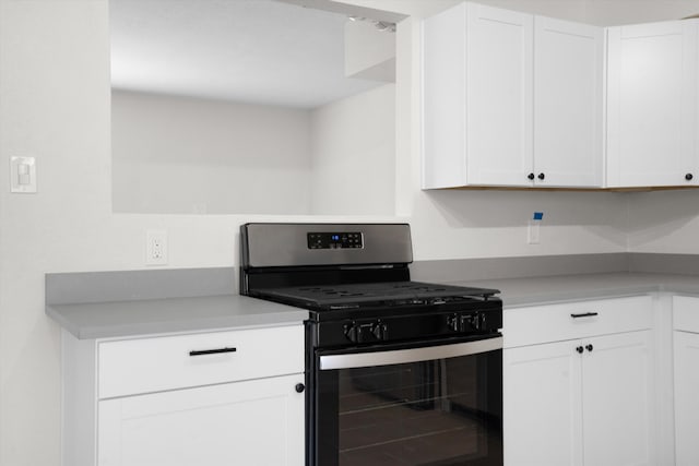 kitchen with white cabinetry and range with gas cooktop