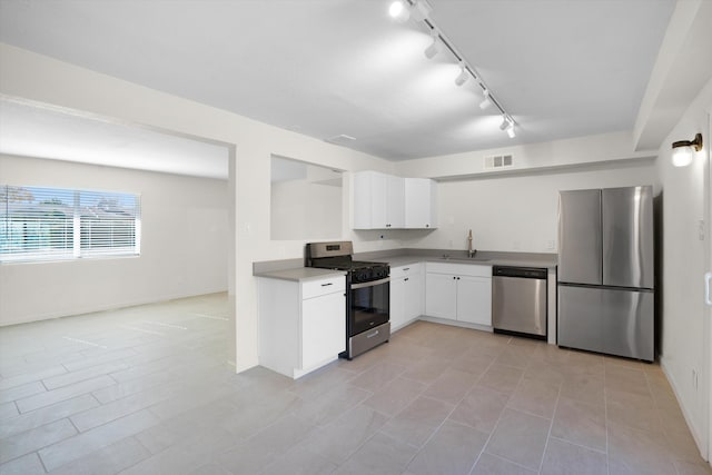 kitchen featuring white cabinetry, sink, and stainless steel appliances