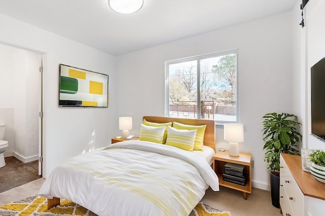 bedroom featuring light carpet