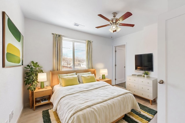 bedroom featuring ceiling fan and light hardwood / wood-style floors