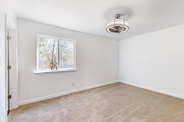 unfurnished room featuring carpet flooring