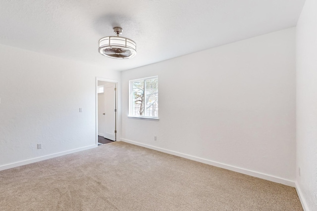 empty room with carpet flooring