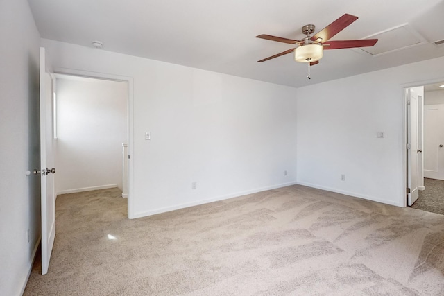 empty room featuring carpet flooring and ceiling fan