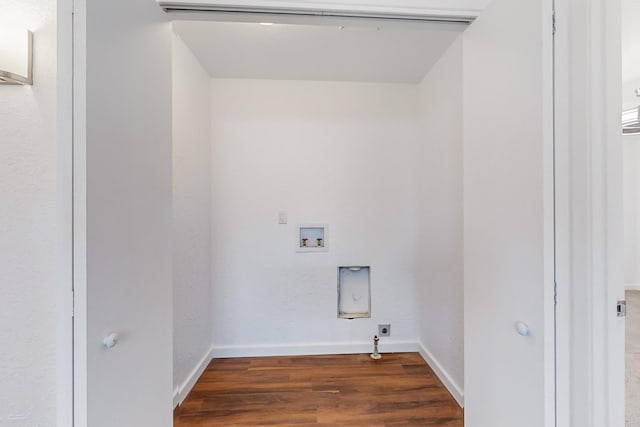 laundry area with hookup for an electric dryer, hookup for a washing machine, dark hardwood / wood-style floors, and gas dryer hookup