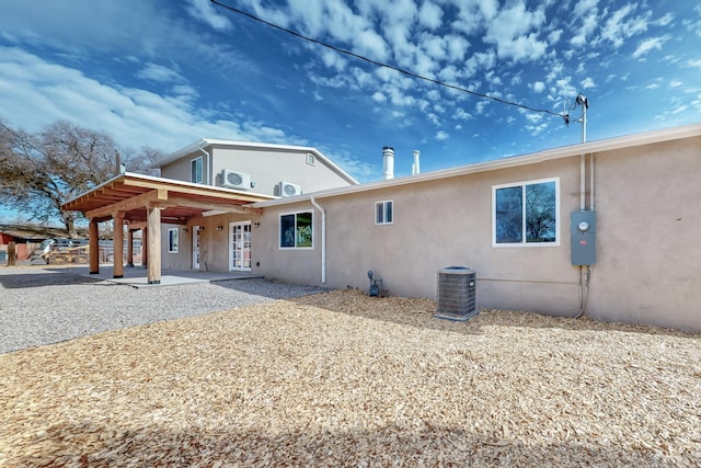 back of house featuring cooling unit and a patio