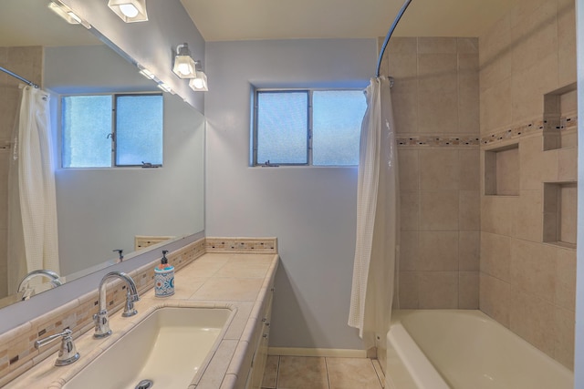 bathroom with tile patterned flooring, vanity, and shower / bath combo with shower curtain