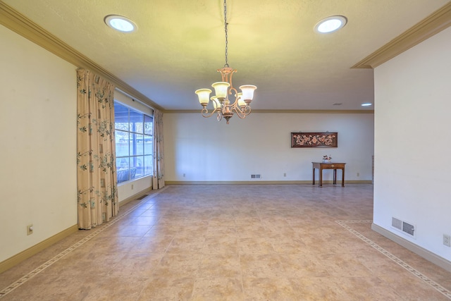 spare room with a textured ceiling, an inviting chandelier, and ornamental molding