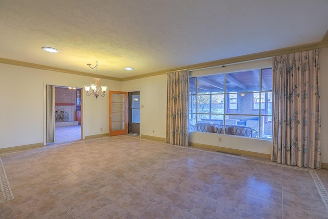 unfurnished room featuring a chandelier, a textured ceiling, and ornamental molding