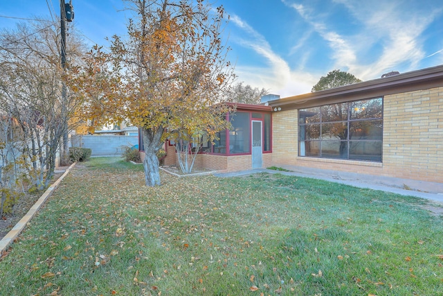 view of yard with a sunroom