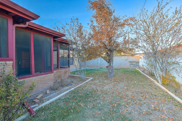 view of yard with a sunroom