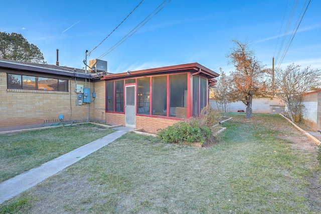 view of yard featuring a sunroom