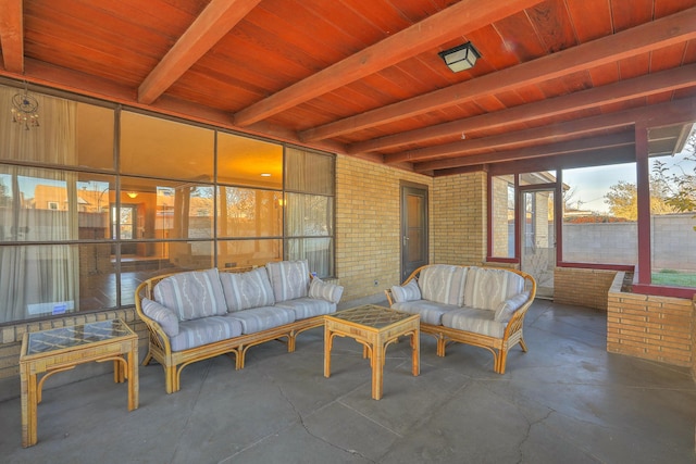 sunroom / solarium with beam ceiling and wooden ceiling