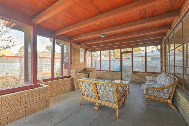 sunroom / solarium with beam ceiling, a water view, and wood ceiling