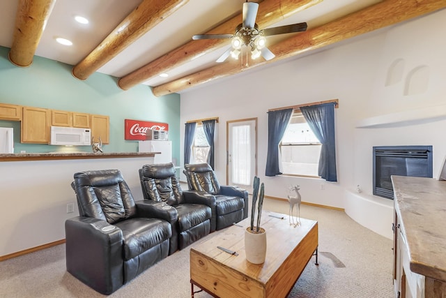 carpeted living room featuring beamed ceiling and ceiling fan