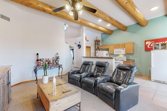 living room with beam ceiling, ceiling fan, a towering ceiling, and light tile patterned floors