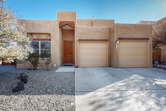 southwest-style home with a garage