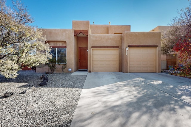 southwest-style home with a garage