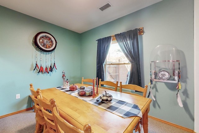 dining room featuring carpet floors