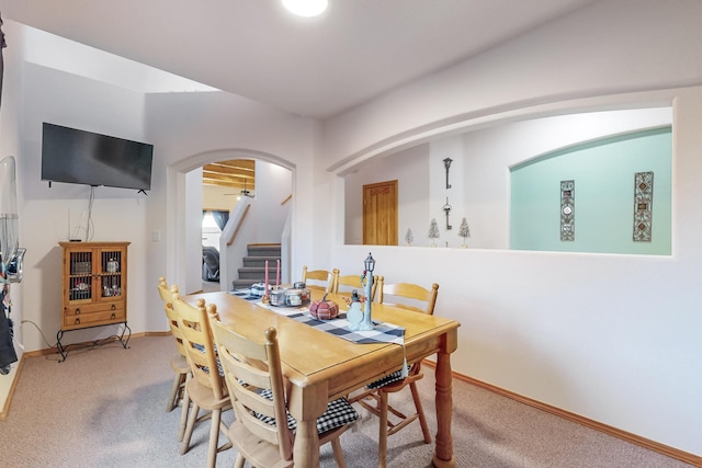 dining space featuring carpet flooring