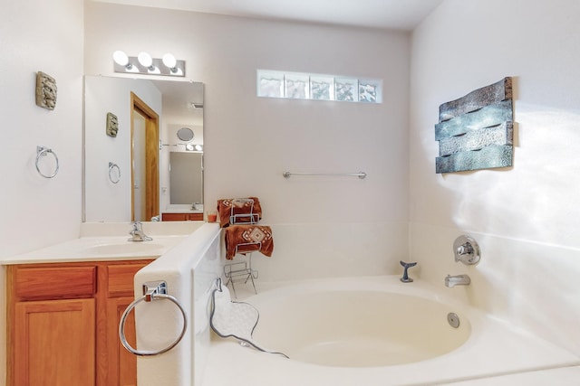 bathroom with vanity and a tub to relax in