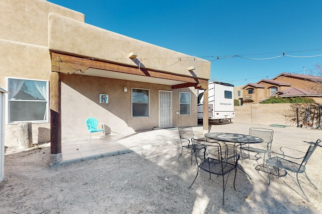 back of property featuring a patio