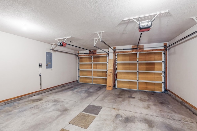 garage featuring electric panel and a garage door opener