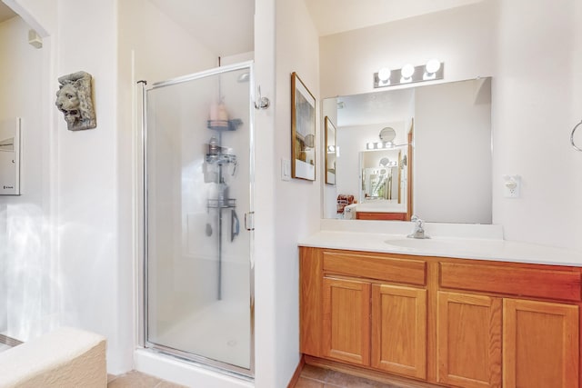 bathroom featuring tile patterned floors, vanity, and an enclosed shower