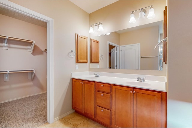 bathroom with tile patterned floors and vanity