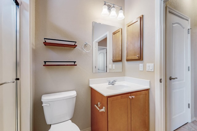 bathroom with toilet and vanity