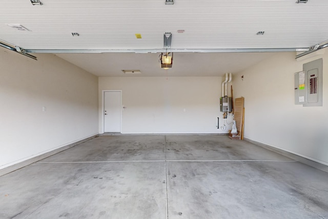 garage featuring a garage door opener, electric panel, and baseboards