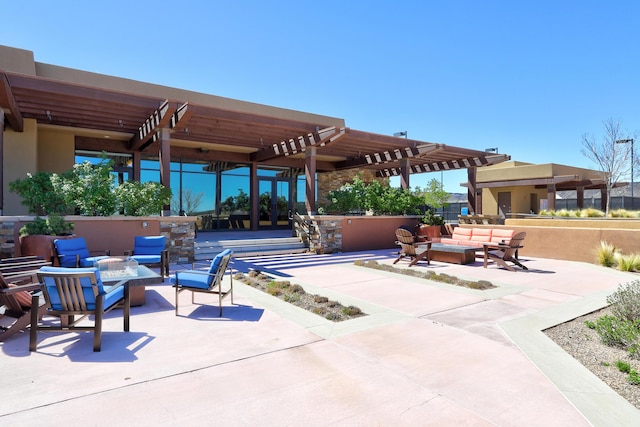 view of patio / terrace featuring an outdoor living space with a fire pit and a pergola