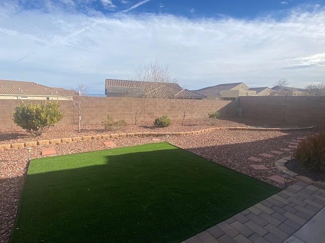 view of yard with a fenced backyard