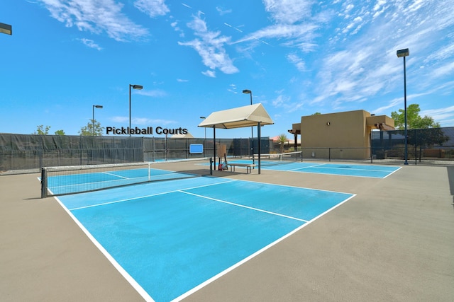 view of sport court featuring fence