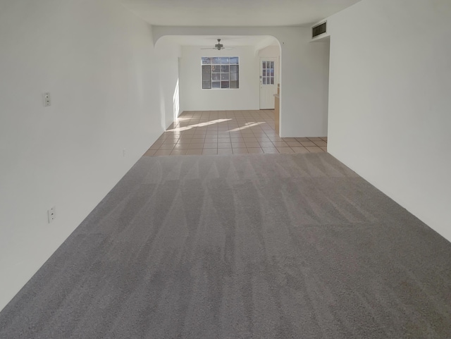 hallway featuring light tile patterned floors