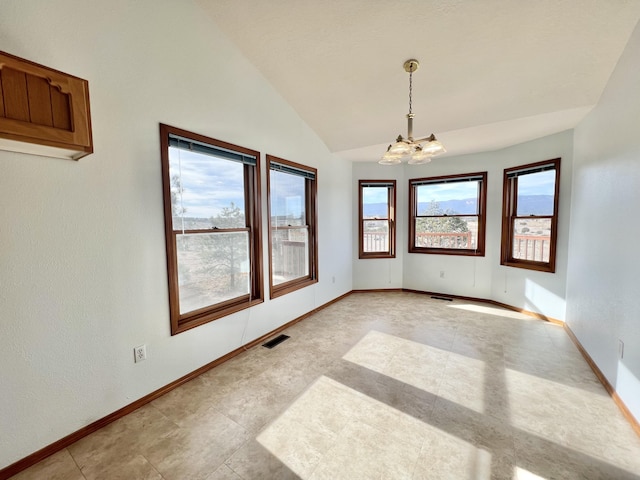 unfurnished room featuring lofted ceiling and a notable chandelier