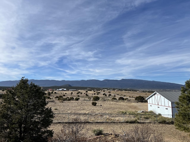 view of mountain feature with a rural view