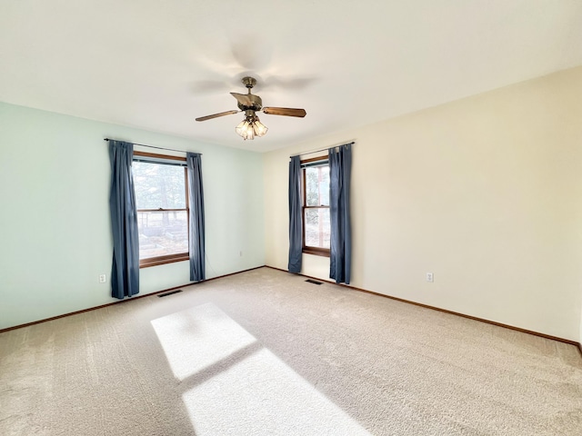 carpeted empty room with ceiling fan